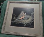 art: a robin feeds hungry nestlings in a nest, scratchboard