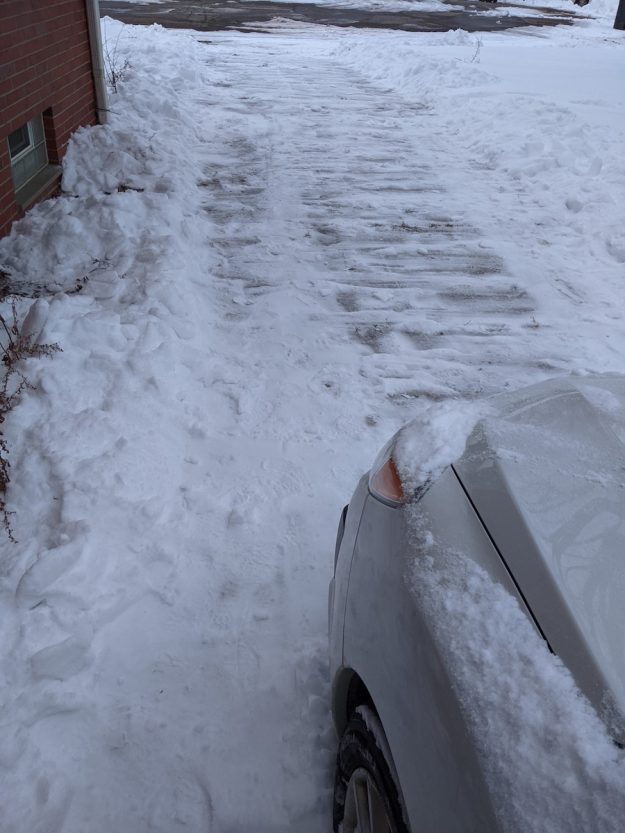 shoveled driveway, car ready to go